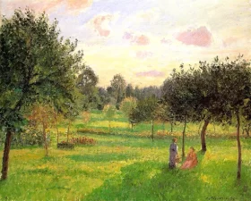 Two Women in a Meadow- Sunset at Eragny by Camille Pissarro