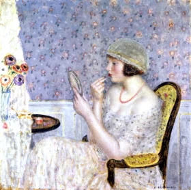 Woman At A Dressing Table by Frederick Carl Frieseke