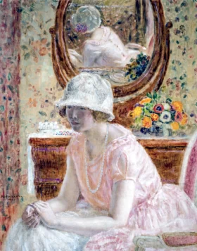 Young Girl Before A Mirror In A Pink Dress by Frederick Carl Frieseke